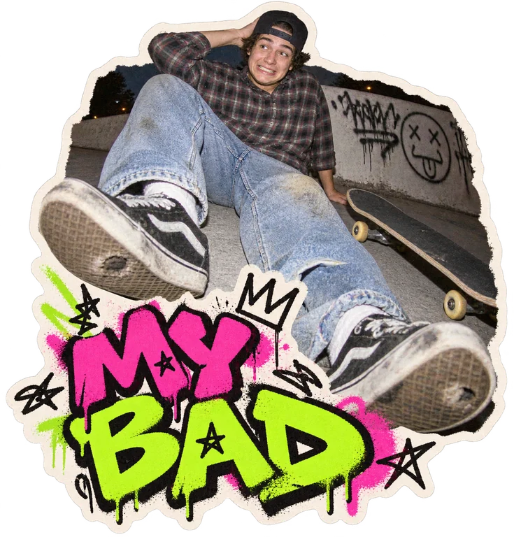 MY BAD. A fisheye flash photo of a skater sitting on their skateboard, with graffiti lettering.